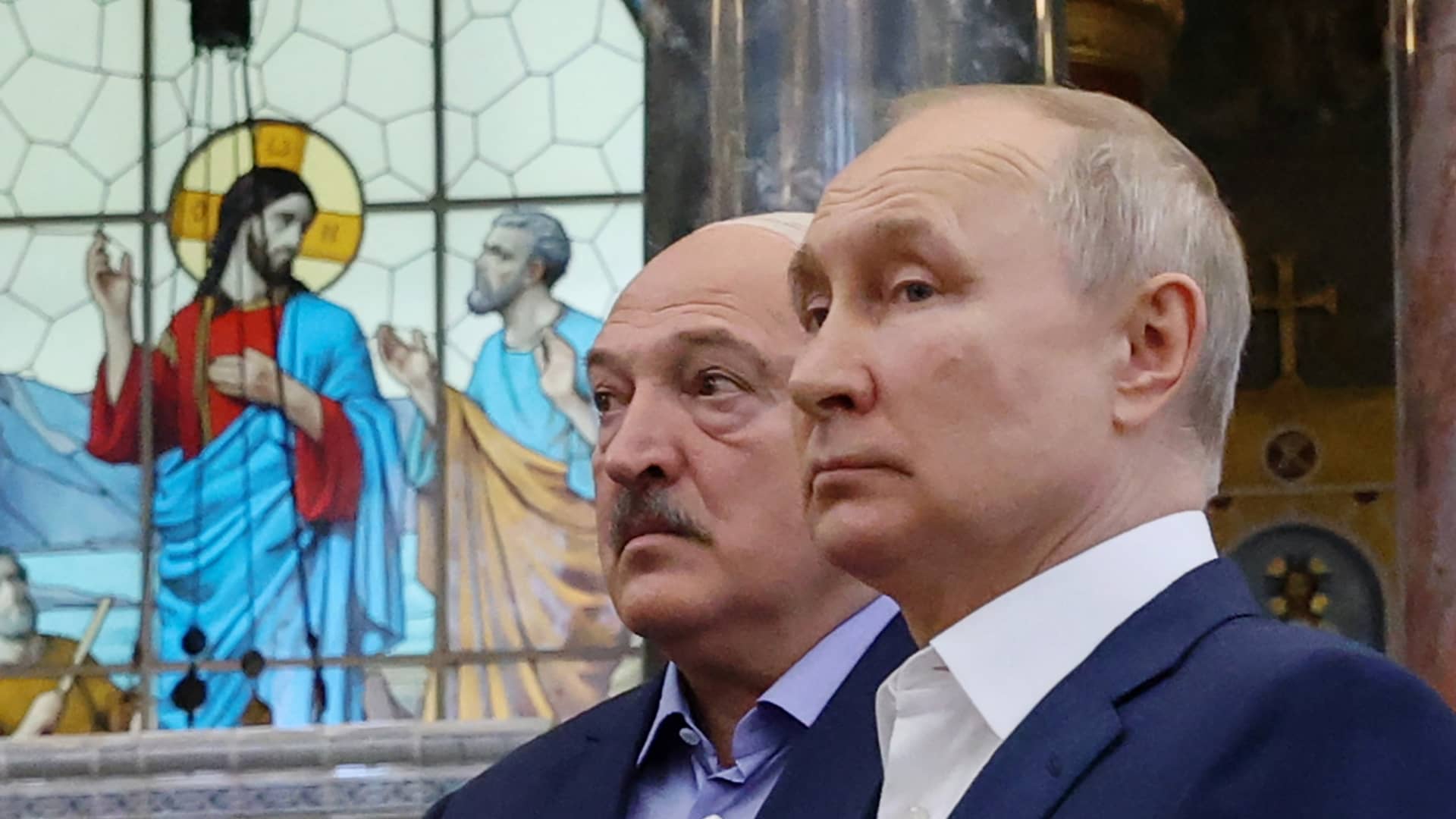 Russia's President Vladimir Putin (R) and Belarus' President Alexander Lukashenko (L) visit The Naval Cathedral of Saint Nicholas in Kronstadt, on Kotlin Island, outside Saint Petersburg, on July 23, 2023.