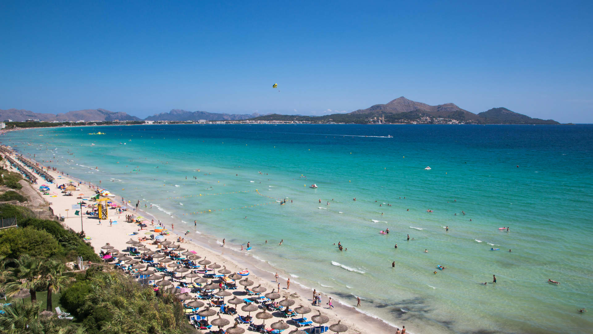Playa de Muro near Port d'Alcudia has warm, shallow water and white sand.