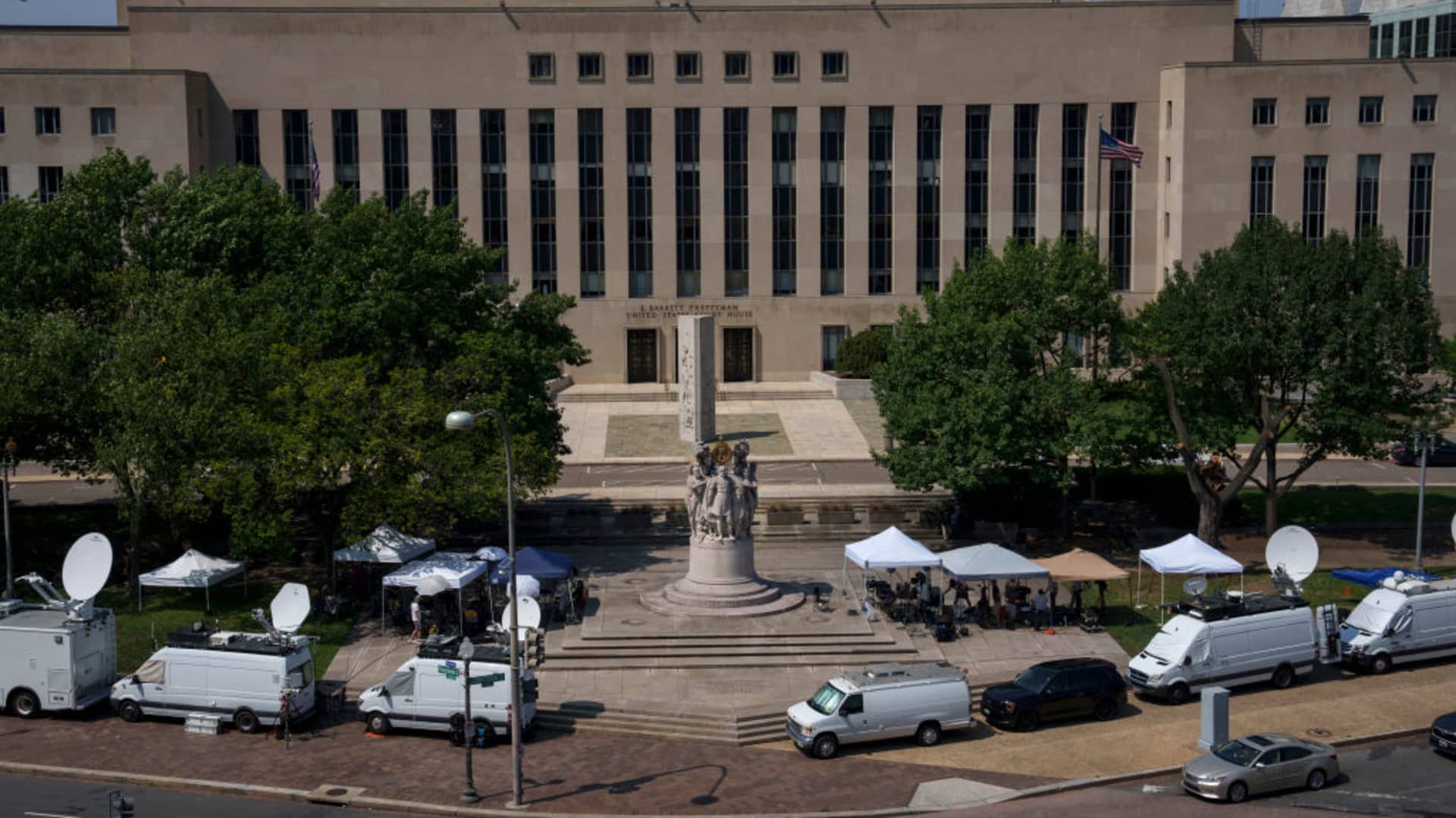 Media tents and television satellite trucks are set up outside the E. Barrett Prettyman U.S. District Court House on July 27, 2023 in Washington, DC.