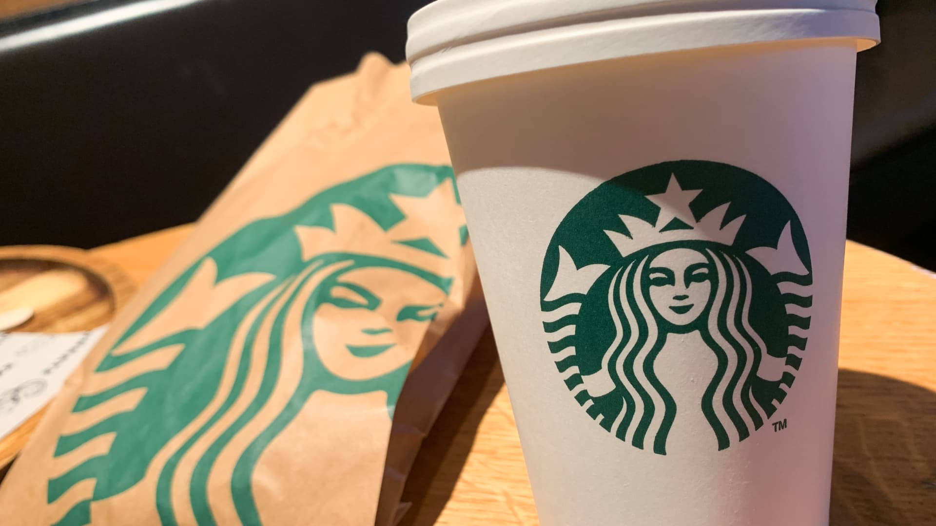 Starbucks logo is seen on a cup in this illustration photo taken in the cafe at the airport in Charleroi, Belgium on July 27, 2023. 