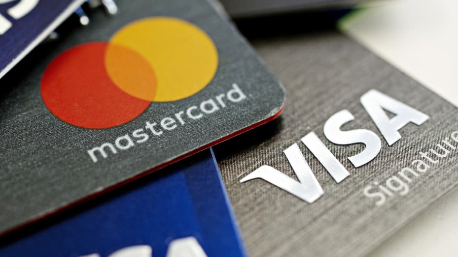 Visa Inc. and Mastercard Inc. credit cards are arranged for a photograph in Tiskilwa, Illinois, U.S.