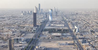 Saudi Arabia's economic growth slows as oil cuts, price drops bite into revenues