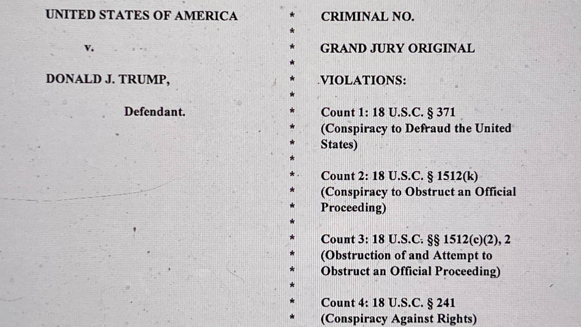 The opening page of an indictment against former U.S. President Donald Trump is seen after he was hit with criminal charges for a third time in four months - this time arising from efforts to overturn his 2020 U.S. election defeat, in a photo illustration August 1, 2023. 