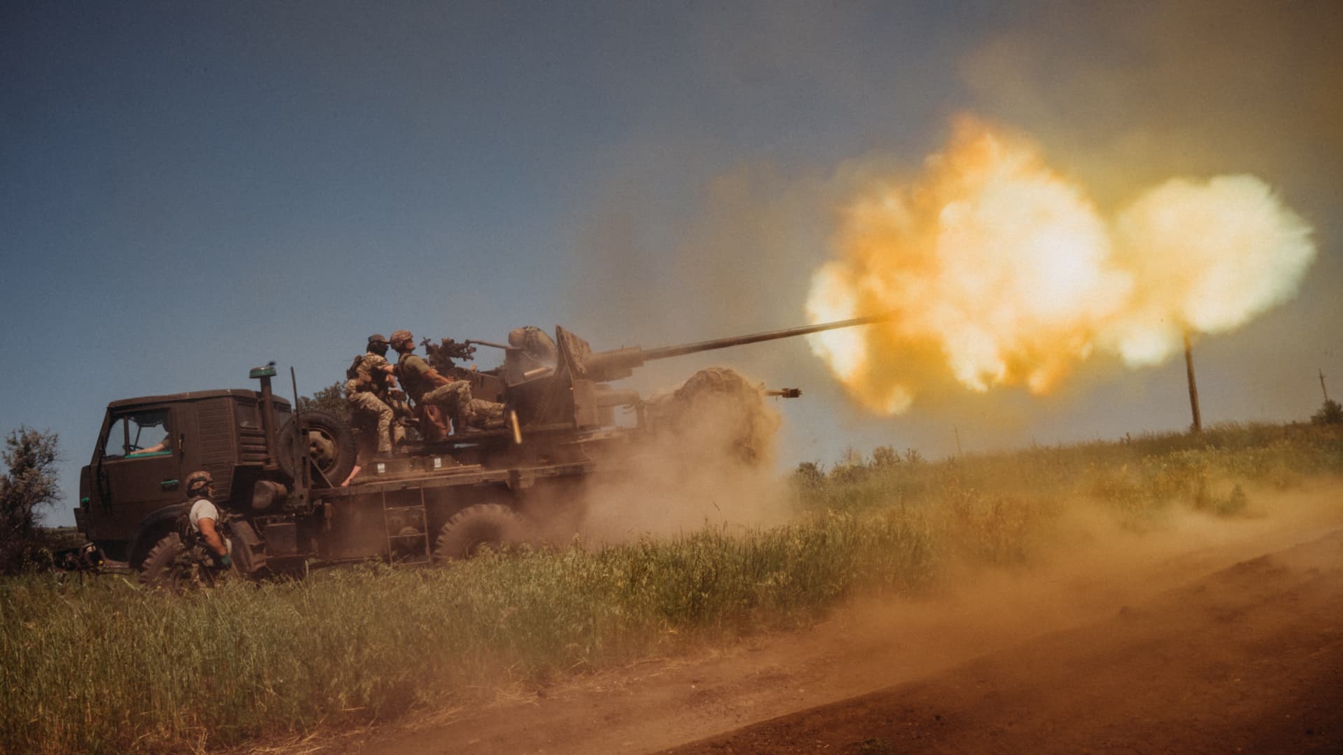 Ukrainian soldiers from the 60th Battalion of Territorial Defense shoot rounds into Russian positions, outside Bakhmut, Ukraine, on June 19, 2023.