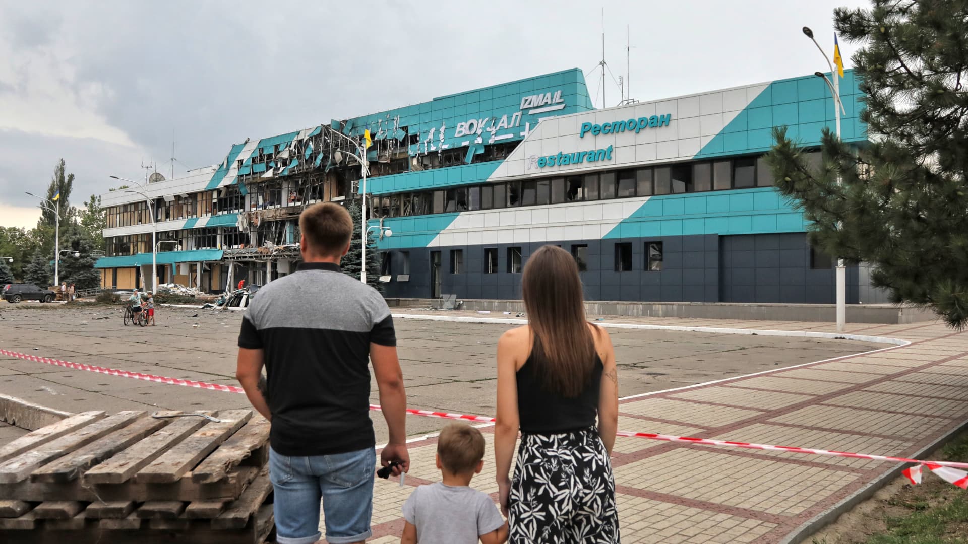 Members of the public look at the Marine Terminal building damaged in the Russian drone attack on the port infrastructure of Izmail situated on the Danube River Wednesday night, August 2, Izmail, Odesa Region, southern Ukraine. (Photo credit should read Nina Liashonok / Ukrinform/Future Publishing via Getty Images)