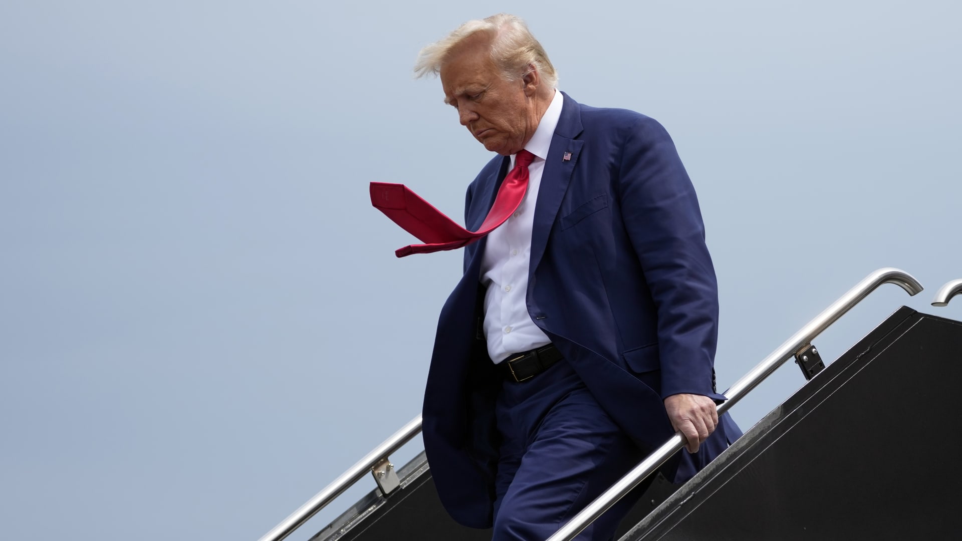 Former President Donald Trump arrives at Ronald Reagan Washington National Airport, Thursday, Aug. 3, 2023, in Arlington, Va., as he heads to Washington to face a judge on federal conspiracy charges alleging Trump conspired to subvert the 2020 election.