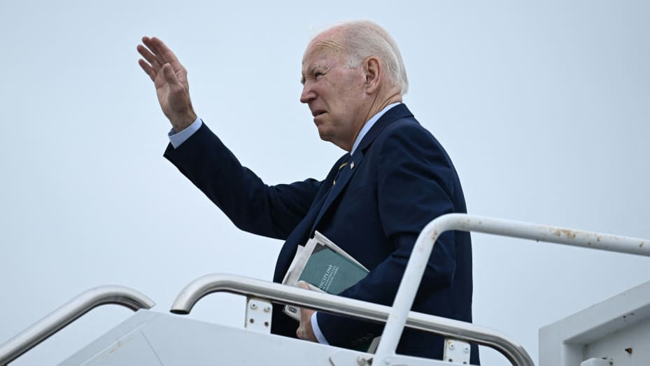 U.S. President Joe Biden waves as he departs from Delaware Air National Guard Base in New Castle, Delaware, on August 7, 2023, enroute to Joint Base Andrews.