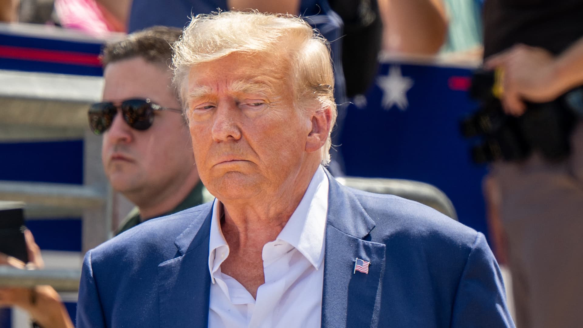 Republican presidential candidate and former U.S. President Donald Trump is directed to his vehicle after speaking at the Steer N' Stein bar at the Iowa State Fair on August 12, 2023 in Des Moines, Iowa.