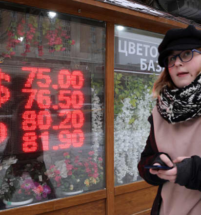 Russian ruble weakens past symbolic threshold of 100 against the dollar