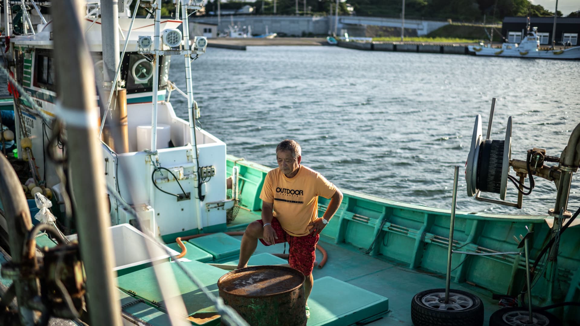 Fisherman Haruo Ono stands on one of his fishing boats at Tsurushihama Fishing Port, Shinchi-machi of Fukushima Prefecture, some 60 kms north of the crippled Fukushima Daiichi nuclear plant on August 21, 2023, ahead of a government's plan to begin releasing treated water from the plant into the Pacific Ocean.