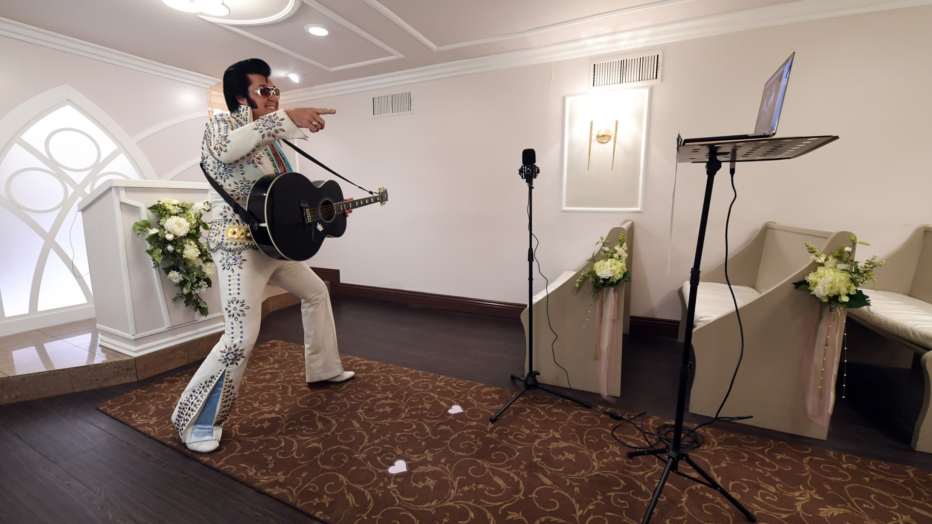 An Elvis impersonator performs a remote vow renewal ceremony during the pandemic at Graceland Wedding Chapel in Las Vegas, Nevada.