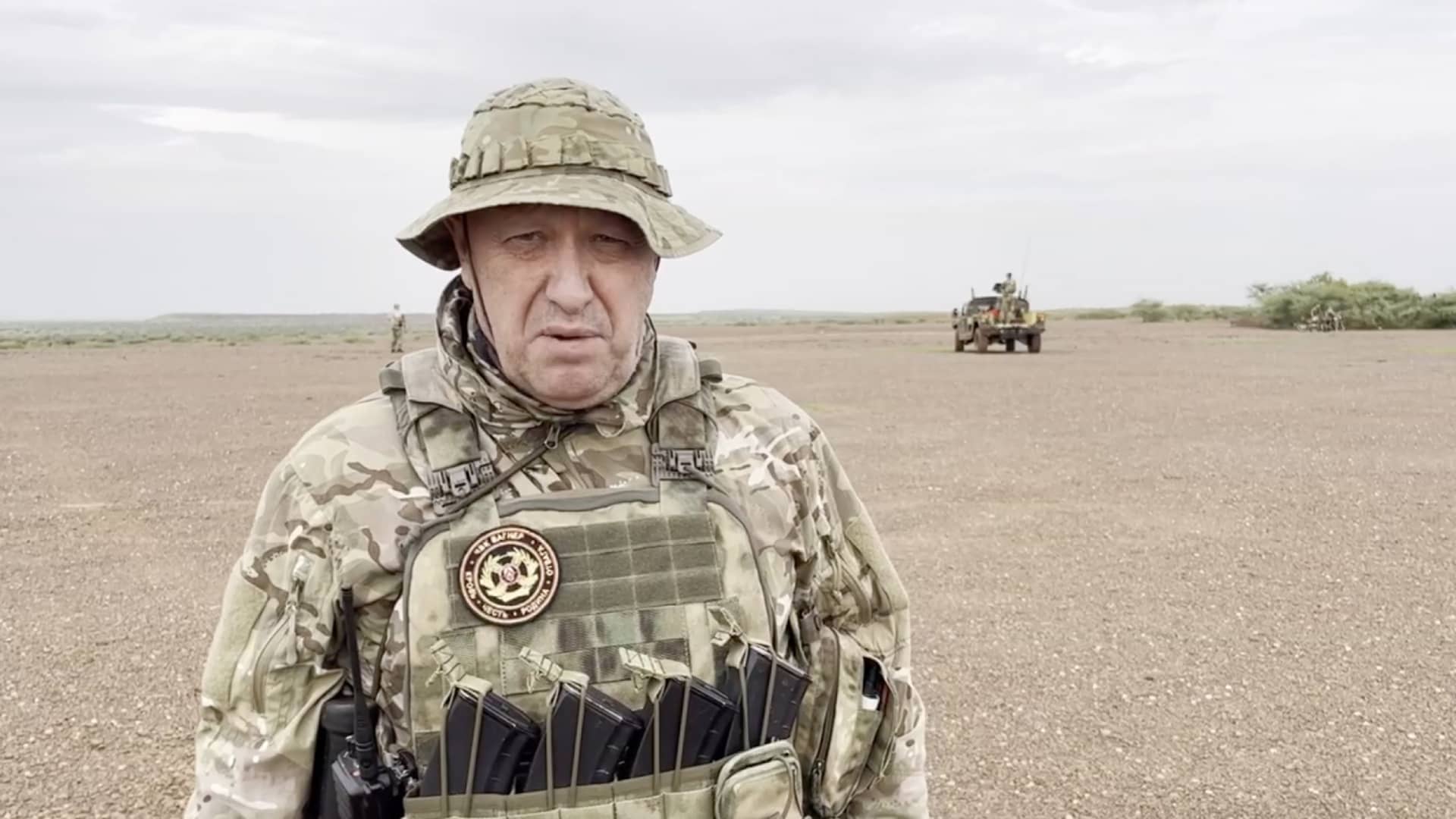 A screen grab captured from a video shared online shows Yevgeny Prigozhin, the founder of the Russian private security company Wagner, holding a rifle in a desert area while wearing camouflage in a video for the first time after his rebellion against the Russian administration in an unspecified location in Africa on August 21, 2023. In the footage shared on the Telegram channel 'Wagner's evacuation', Prigozhin stated that they have made Russia 'even greater' on all continents, including Africa. 
