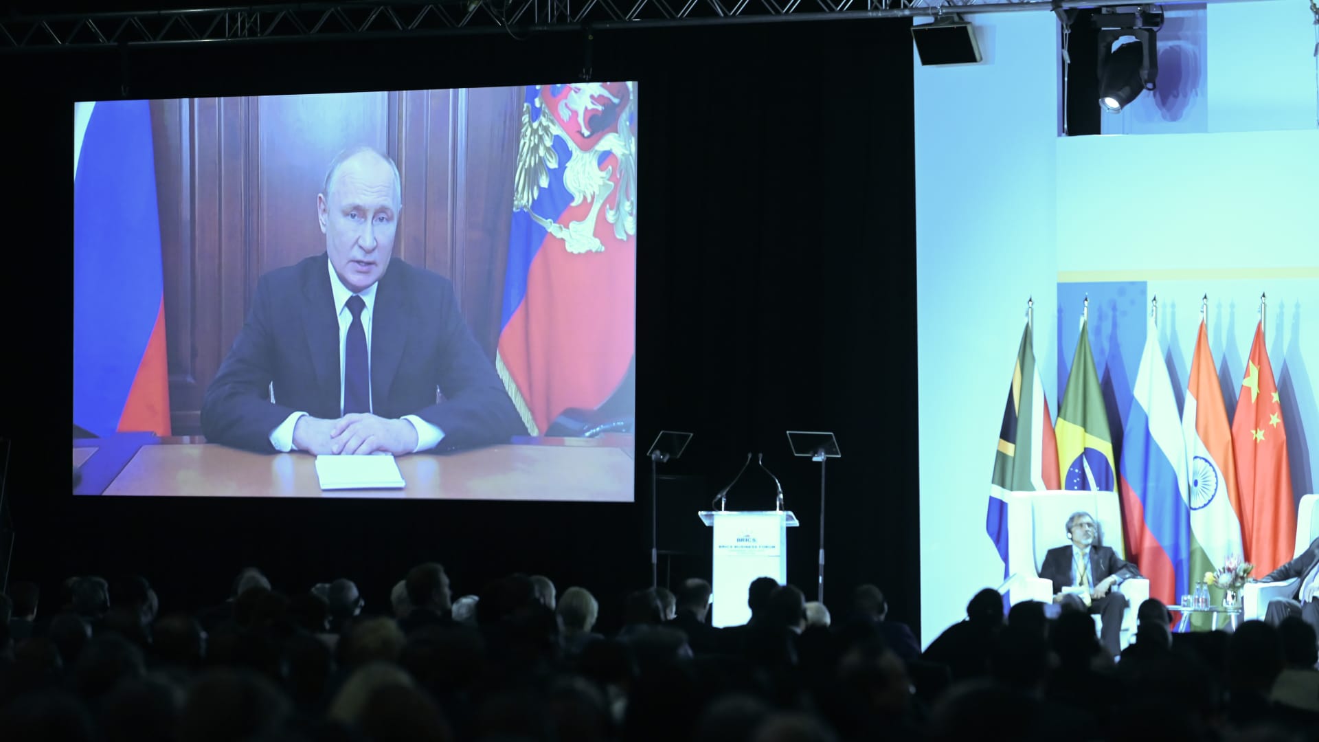 Vladimir Putin, Russia's president, speaks by video link during the BRICS business forum on the opening day of the BRICS summit at the Sandton Convention Centre in the Sandton district of Johannesburg, South Africa, on Aug. 22, 2023.