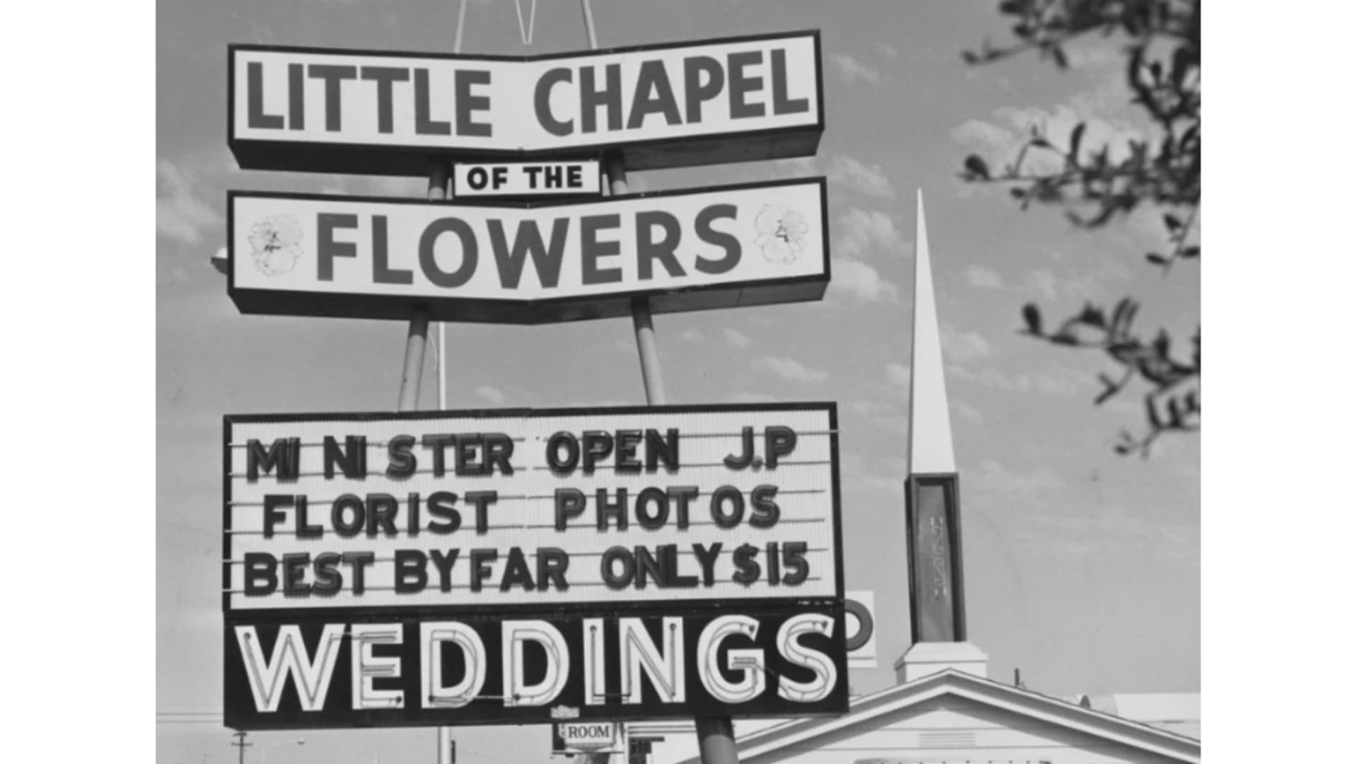 A picture taken in 1953 of a sign outside the Chapel of the Flowers promoting its $15 wedding packages.