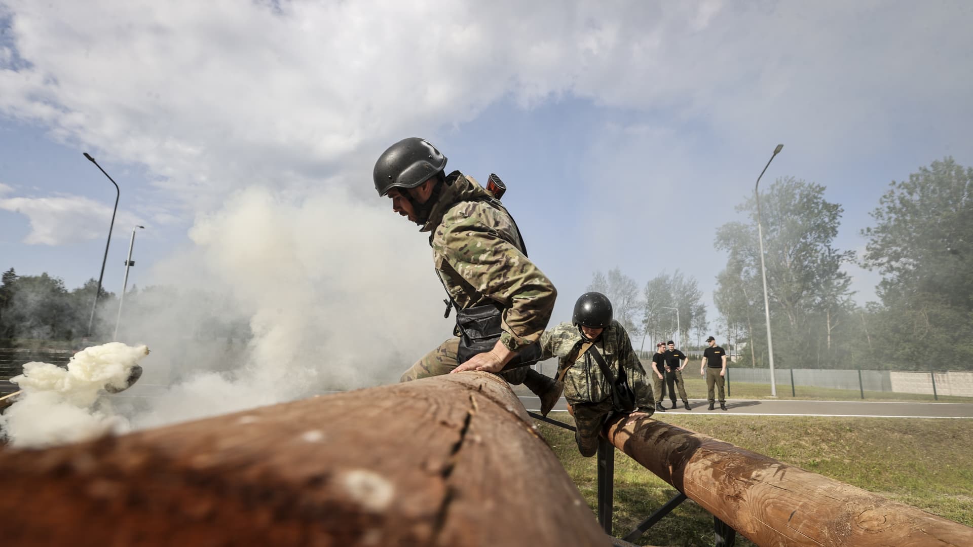 Police officers of the Ministry of Internal Affairs try to pass qualification tests for the right to wear a black beret at racetrack in Gorani district of Minsk, Belarus on May 30, 2023.