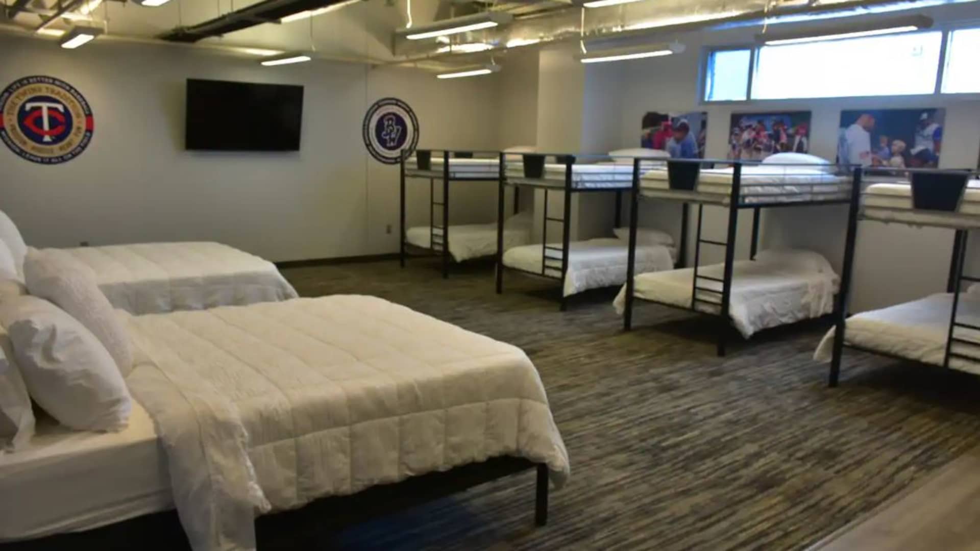 The bedroom at Blue Wahoos Stadium sleeps a maximum of 10 guests.
