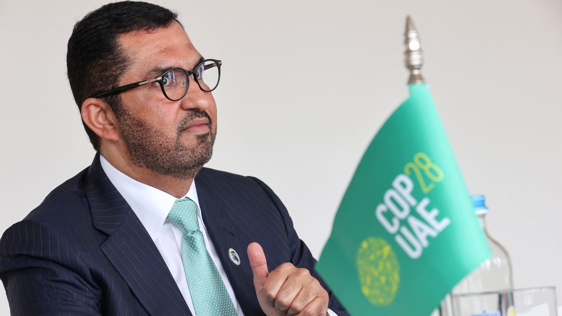 Sultan Al Jaber, chief executive of the UAE's Abu Dhabi National Oil Company (ADNOC) and president of this year's COP28 climate summit gestures during an interview as part of the 7th Ministerial on Climate Action (MoCA) in Brussels on July 13, 2023.