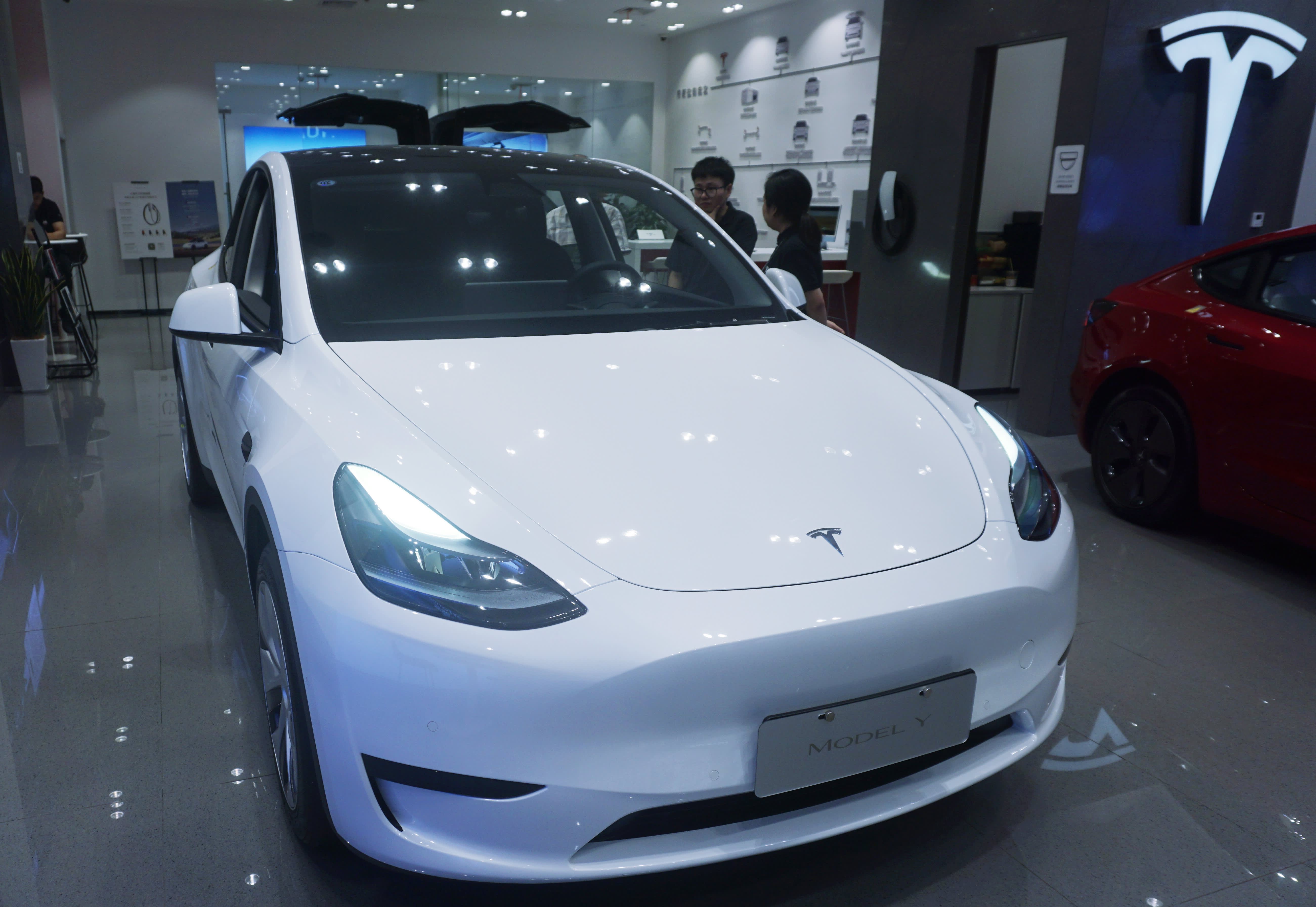 Tesla launches new Model 3 in China, Europe with longer driving range