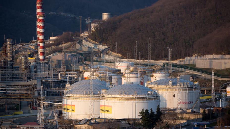 Oil storage tanks stand at the RN-Tuapsinsky refinery, operated by Rosneft Oil Co., as the sun sets in Tuapse, Russia, on Sunday, March 22, 2020. Major oil currencies have fallen much more this month following the plunge in Brent crude prices to less than $30 a barrel, with Russias ruble down by 15%. Photographer: Andrey Rudakov/Bloomberg via Getty Images