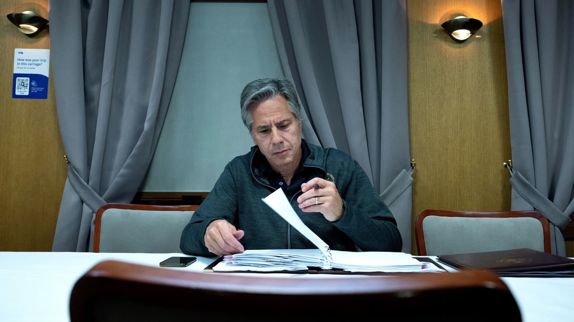 U.S. Secretary of State Antony Blinken works while traveling by train to Kyiv on September 6, 2023. Blinken arrived in Kyiv on an unannounced visit and is due to announce more than a billion dollars in fresh aid to Ukraine.