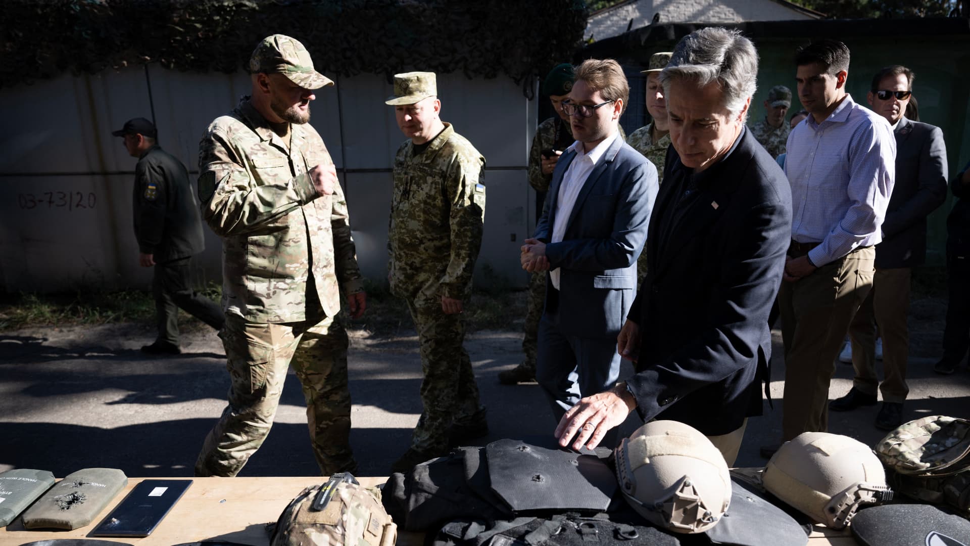 US Secretary of State Antony Blinken looks a spent body armor while touring a State Border Guard of Ukraine Detached Commandant Office of Security and Resource Supply site September 7, 2023, in theKyiv Oblast. 