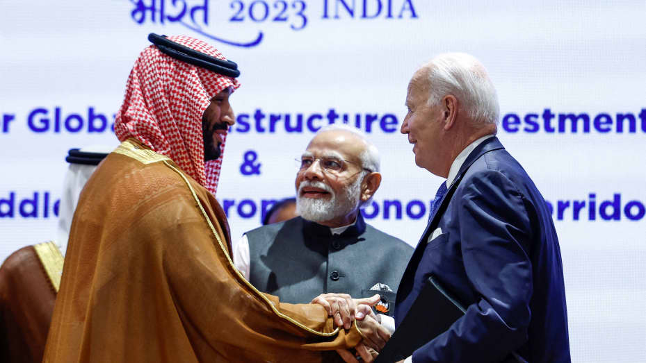 Saudi Arabian Crown Prince Mohammed bin Salman Al Saud and U.S. President Joe Biden shake hands next to Indian Prime Minister Narendra Modi on the day of the G20 summit in New Delhi, India, September 9, 2023. REUTERS/Evelyn Hockstein/Pool TPX IMAGES OF THE DAY