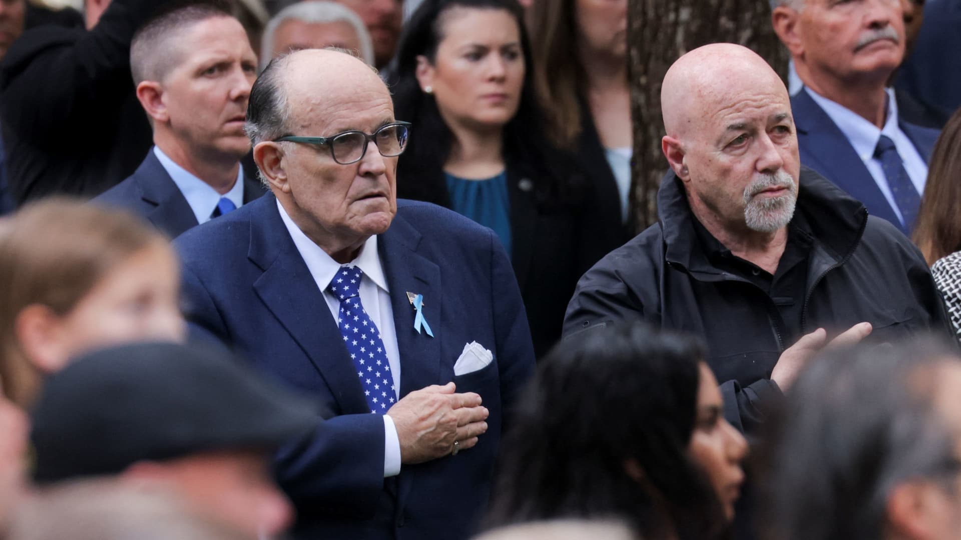 Former New York Mayor Rudy Giuliani, left, attends the ceremony marking the 22nd anniversary of the 9/11 attacks at the National September 11 Memorial & Museum, in New York, Sept. 11, 2023.