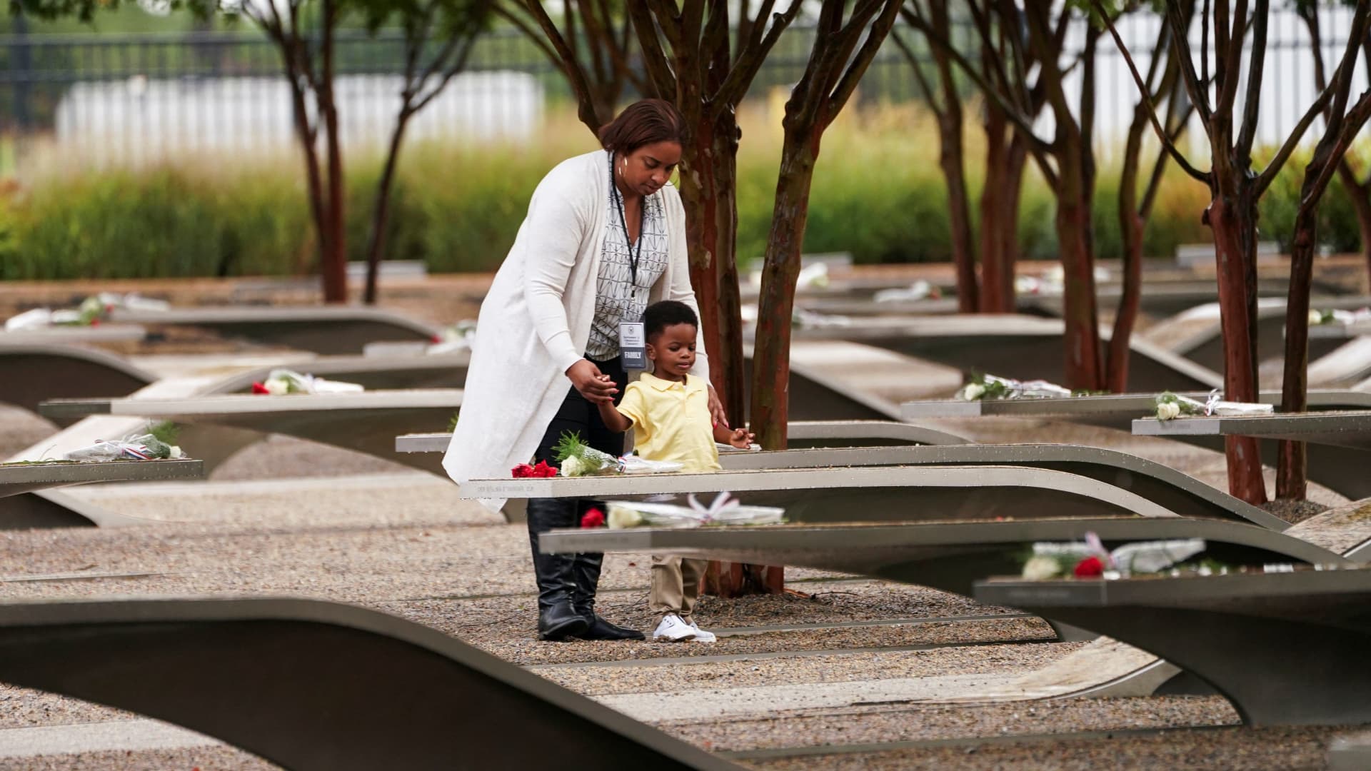 Family members of a victim visit the Pentagon Memorial on the 22nd anniversary of the 9/11 terrorist attacks, Sept. 11, 2023.