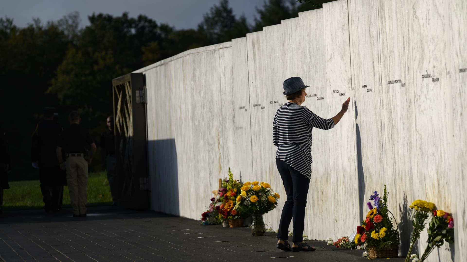 A relative of one of the victims pays her respects at the Wall of Names before a ceremony commemorating the 22nd anniversary of the crash of Flight 93 during the September 11, 2001 terrorist attacks at the Flight 93 National Memorial on September 11, 2023 in Shanksville, Pennsylvania. 