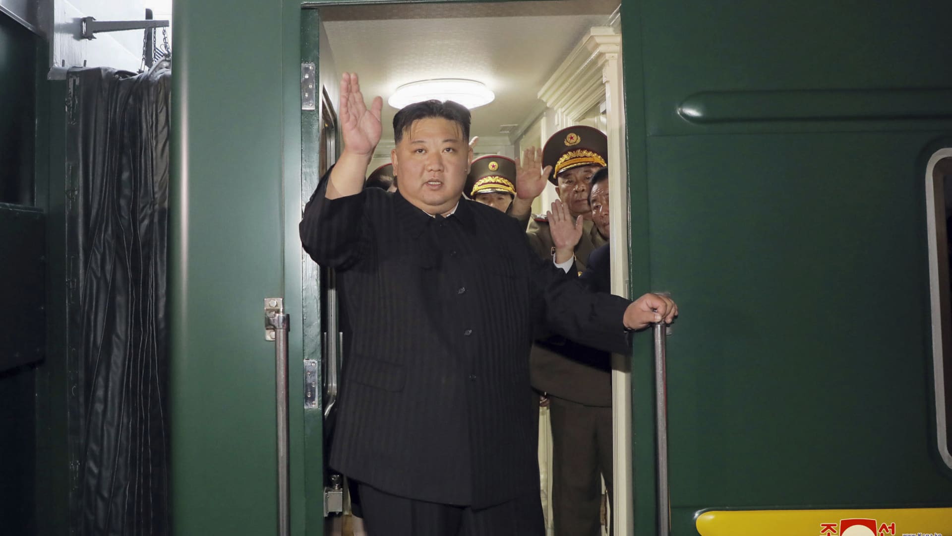 North Korean leader Kim Jong Un waves from a train in Pyongyang, North Korea, on Sept. 10, 2023, as he leaves for Russia.