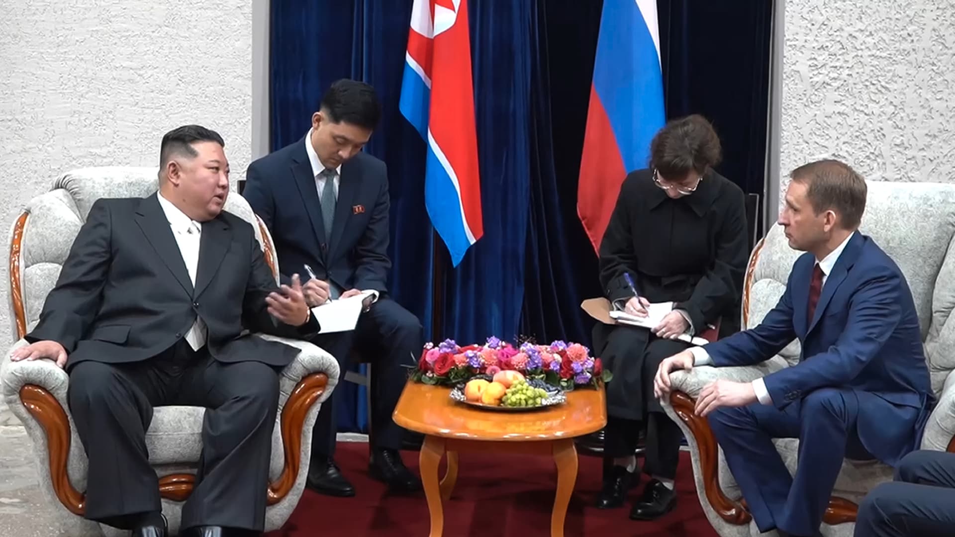 In this photo taken from video released by governor of the Russian far eastern region of Primorsky Krai Oleg Kozhemyako telegram channel on Tuesday, Sept. 12, 2023, North Korea's leader Kim Jong Un, left, gestures as he speaks to Russian Minister of Natural Resources and Ecology Alexander Kozlov, right, after crossing the border to Russia at Khasan, about 127 km (79 miles) south of Vladivostok. 