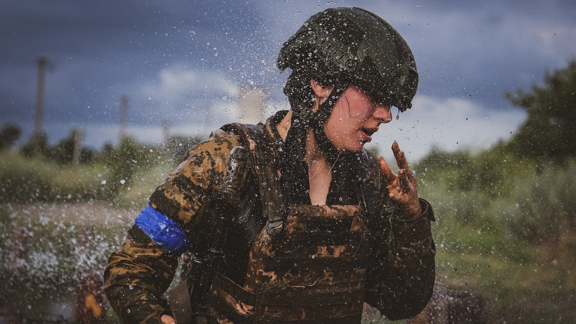 Female members of the Ukrainian Army's 128th Carpathian Mountain Assault Brigade train.