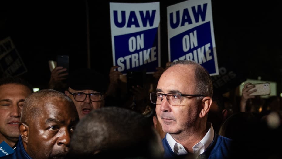 UAW (United Auto Workers) president Shawn Fain speaks with members of the media and members of the UAW outside of the UAW Local 900 headquarters across the street from the Ford Assembly Plant in Wayne, Michigan on September 15, 2023. The US auto workers' union announced the start of a strike at three factories just after midnight on Friday, September 15, as a deadline expired to reach a deal with employers on a new contract. "Tonight, for the first time in our history, we will strike all three of the Big Th