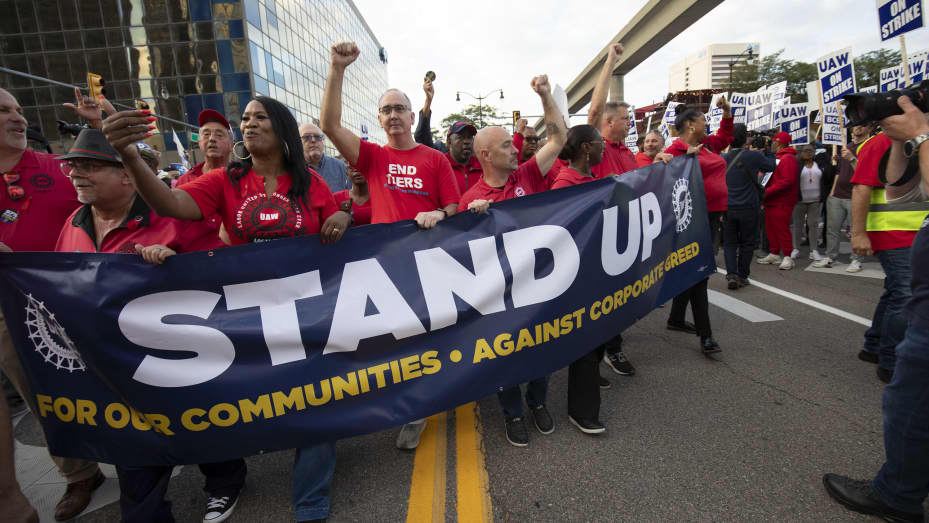 UAW President Shawn Fain marches with UAW members through downtown Detroit after a rally in support of United Auto Workers members as they strike the Big Three auto makers on September 15, 2023 in Detroit, Michigan.
