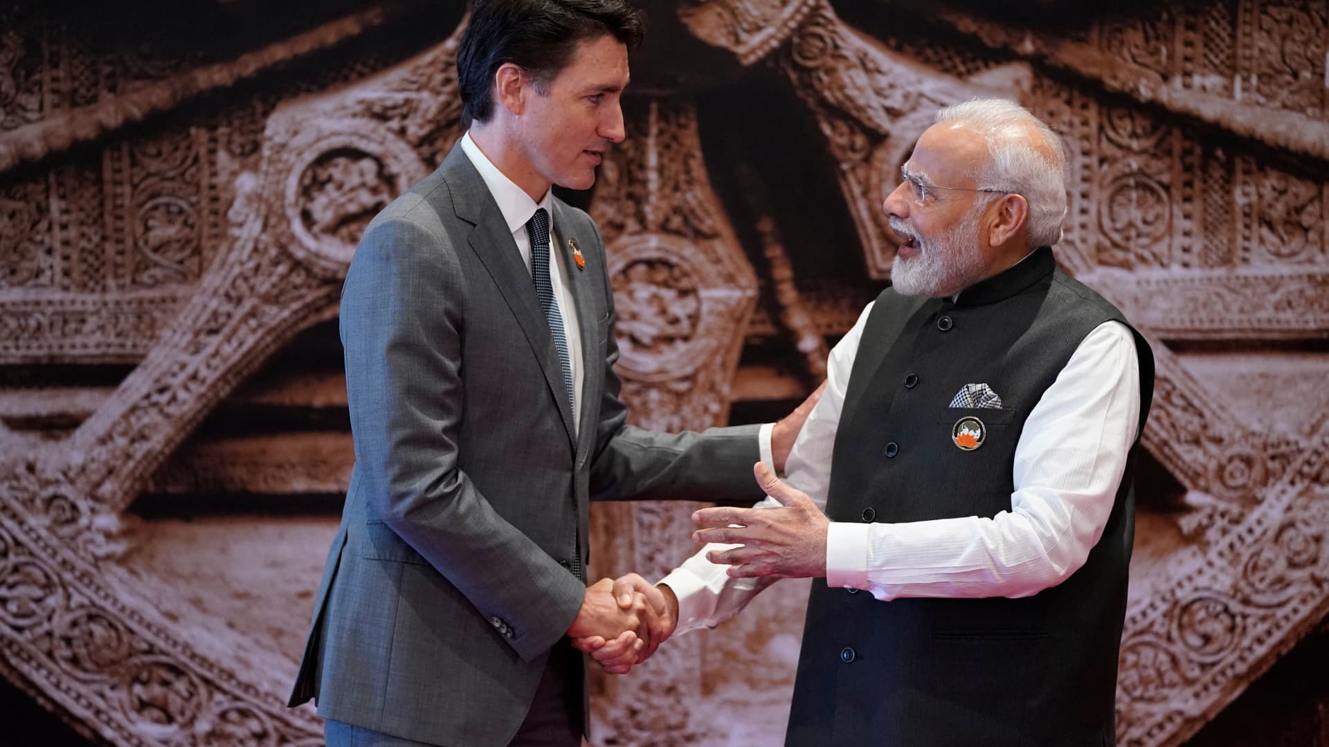 India's Prime Minister Narendra Modi (R) shakes hand with Canada's Prime Minister Justin Trudeau ahead of the G20 Leaders' Summit in New Delhi on September 9, 2023.