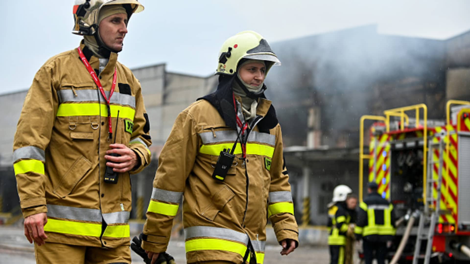 Two State Emergency Service employees look at a response effort to the Russian drone strike at industrial warehouses in Lviv, western Ukraine. In the early hours of Tuesday, September 19, the Russian army launched 18 Shahed one-way attack drones in the direction of Lviv Region. 