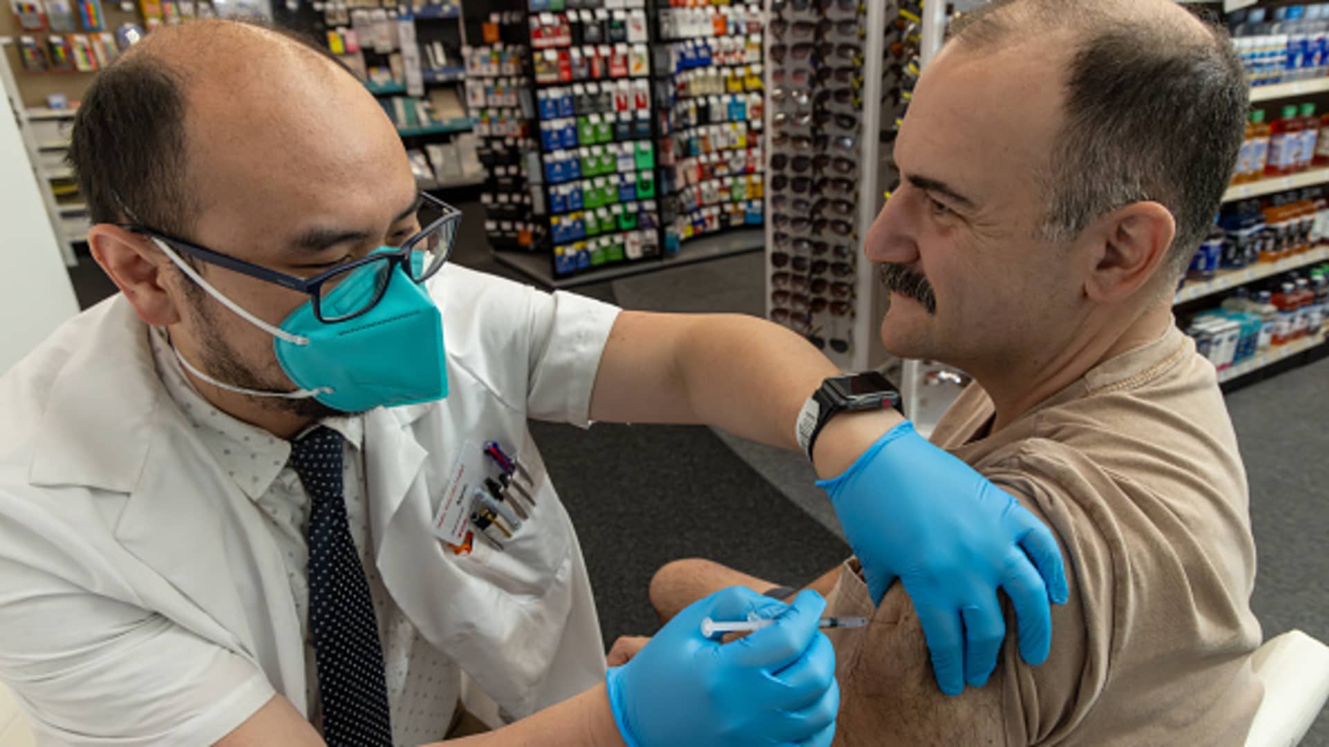 Pharmacist Aaron Sun administers Pfizer's new Covid vaccine to Jimmy Smagula at a CVS Pharmacy in Eagle Rock, California, Sept. 14, 2023.