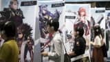 Visitors play the Warriors All-Stars video game in the Koei Tecmo Holdings booth during the Tokyo Game Show 2017 at Makuhari Messe on September 21, 2017 in Chiba, Japan.