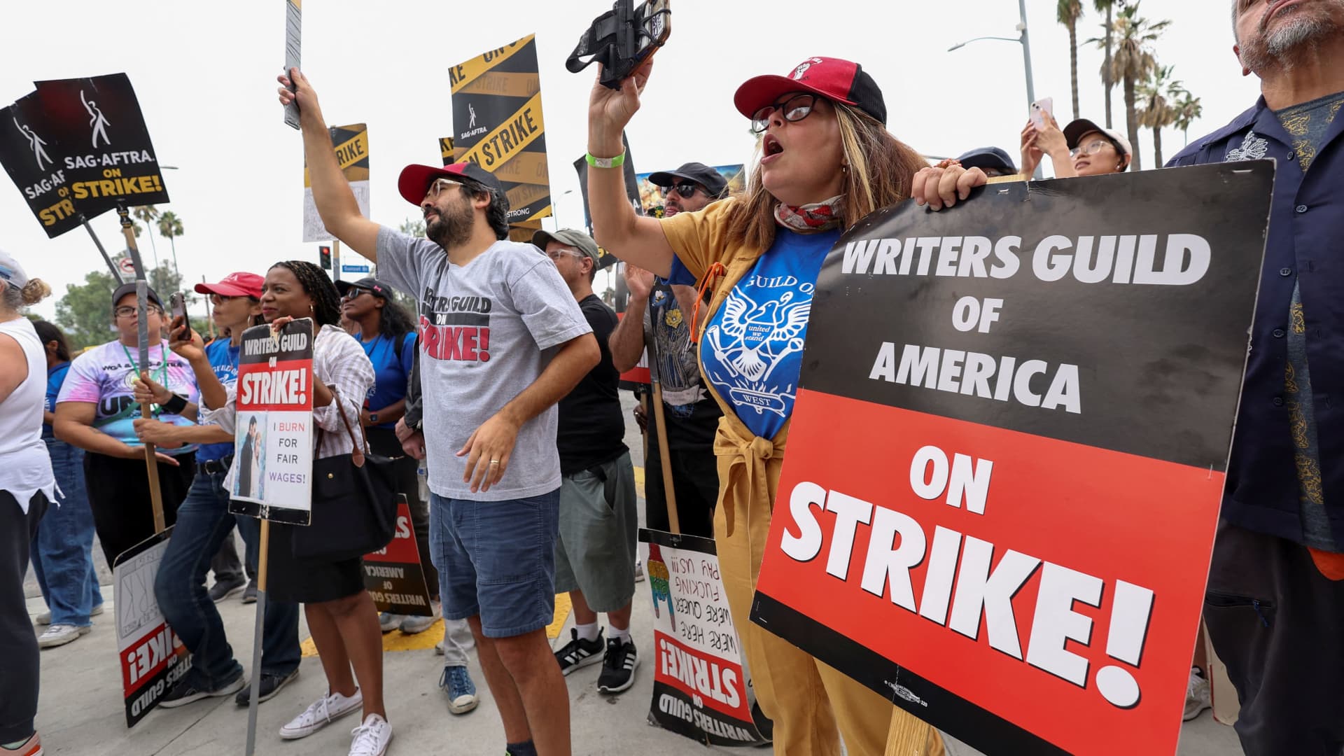 SAG-AFTRA actors and Writers Guild of America (WGA) writers walk the picket line during their ongoing strike outside Netflix offices in Los Angeles, California, September 22, 2023.