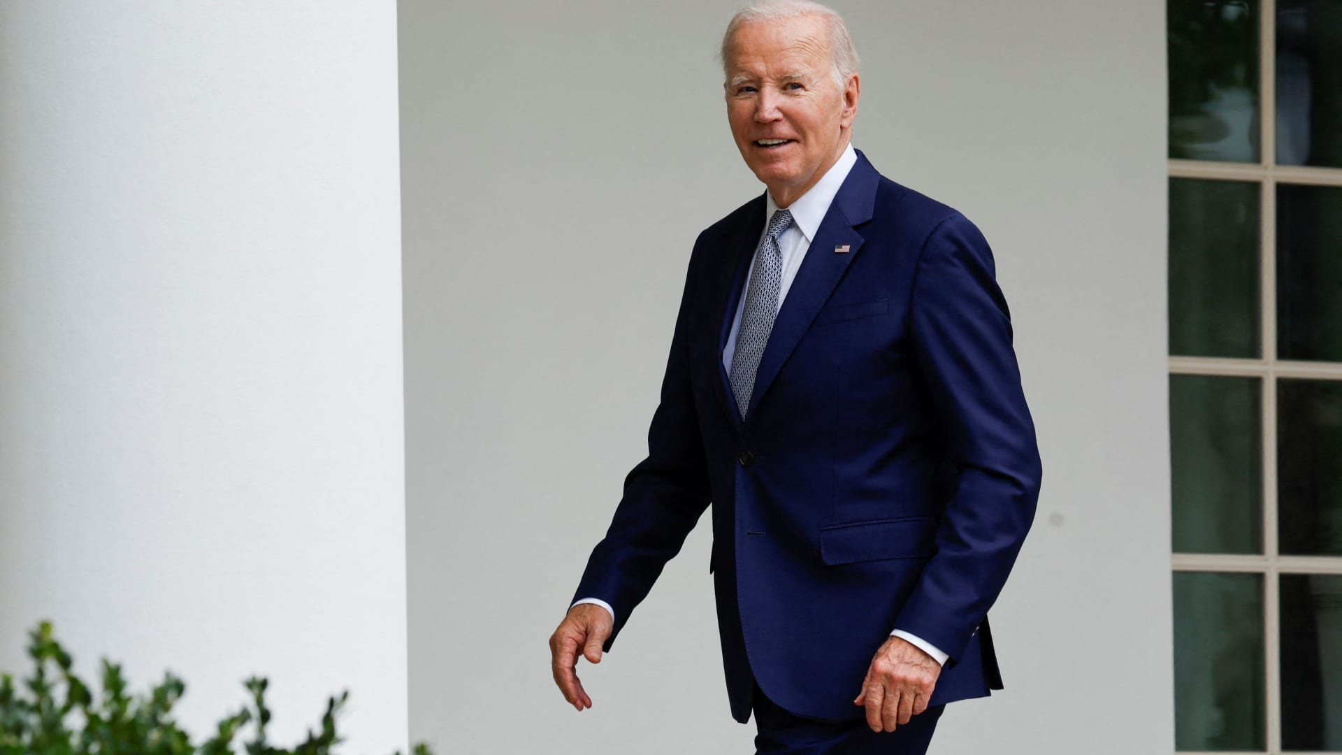 U.S. President Joe Biden smiles as he responds to a reporter's question about whether he will visit striking auto workers on the UAW picket line, as he walks back to the Oval Office after an event announcing the creation of a new White House Office of Gun Violence Prevention, in the Rose Garden of the White House in Washington, U.S. September 22, 2023. 