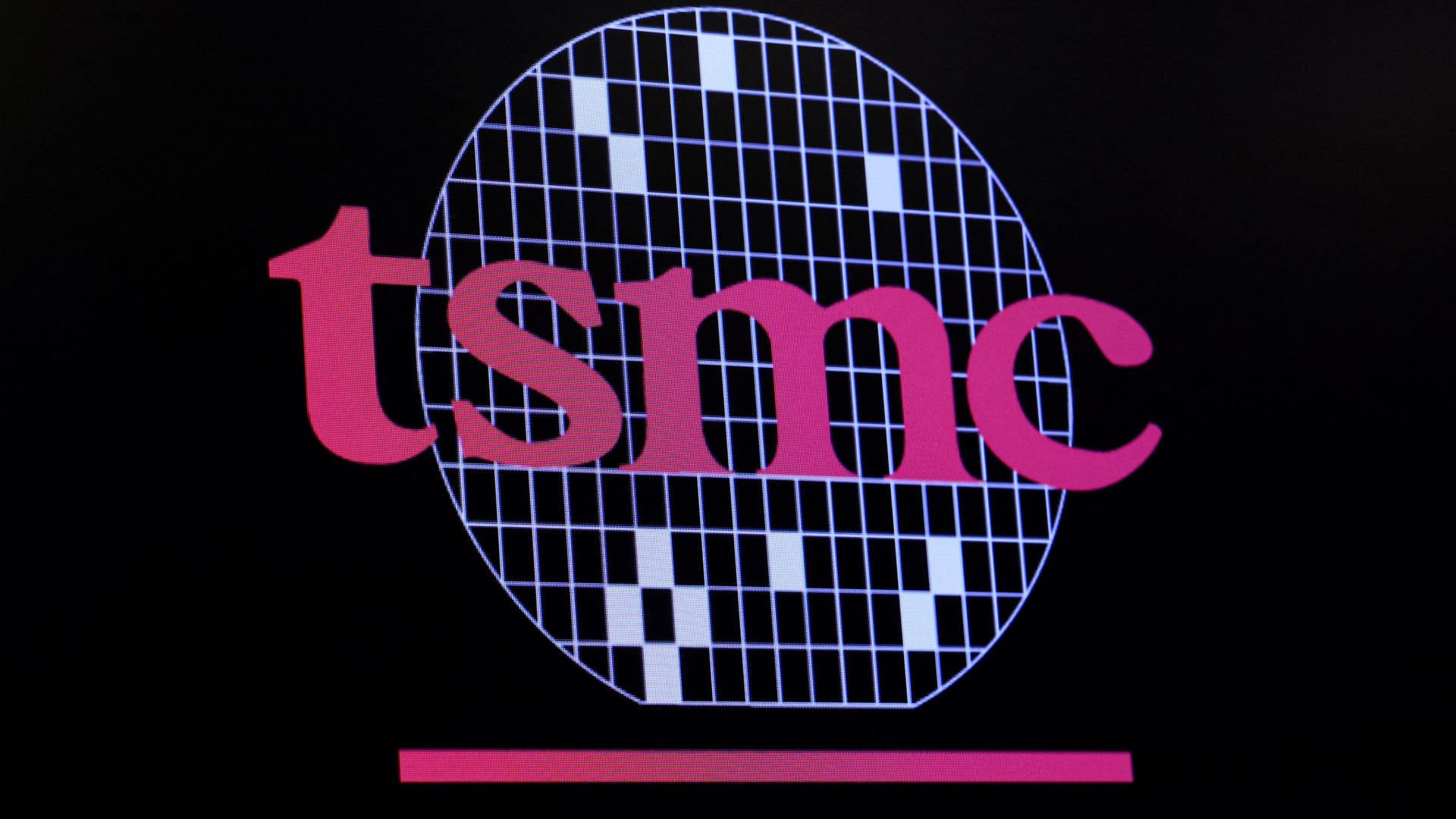The logo for Taiwan Semiconductor Manufacturing Company is displayed on a screen on the floor of the New York Stock Exchange on Sept. 26, 2023.