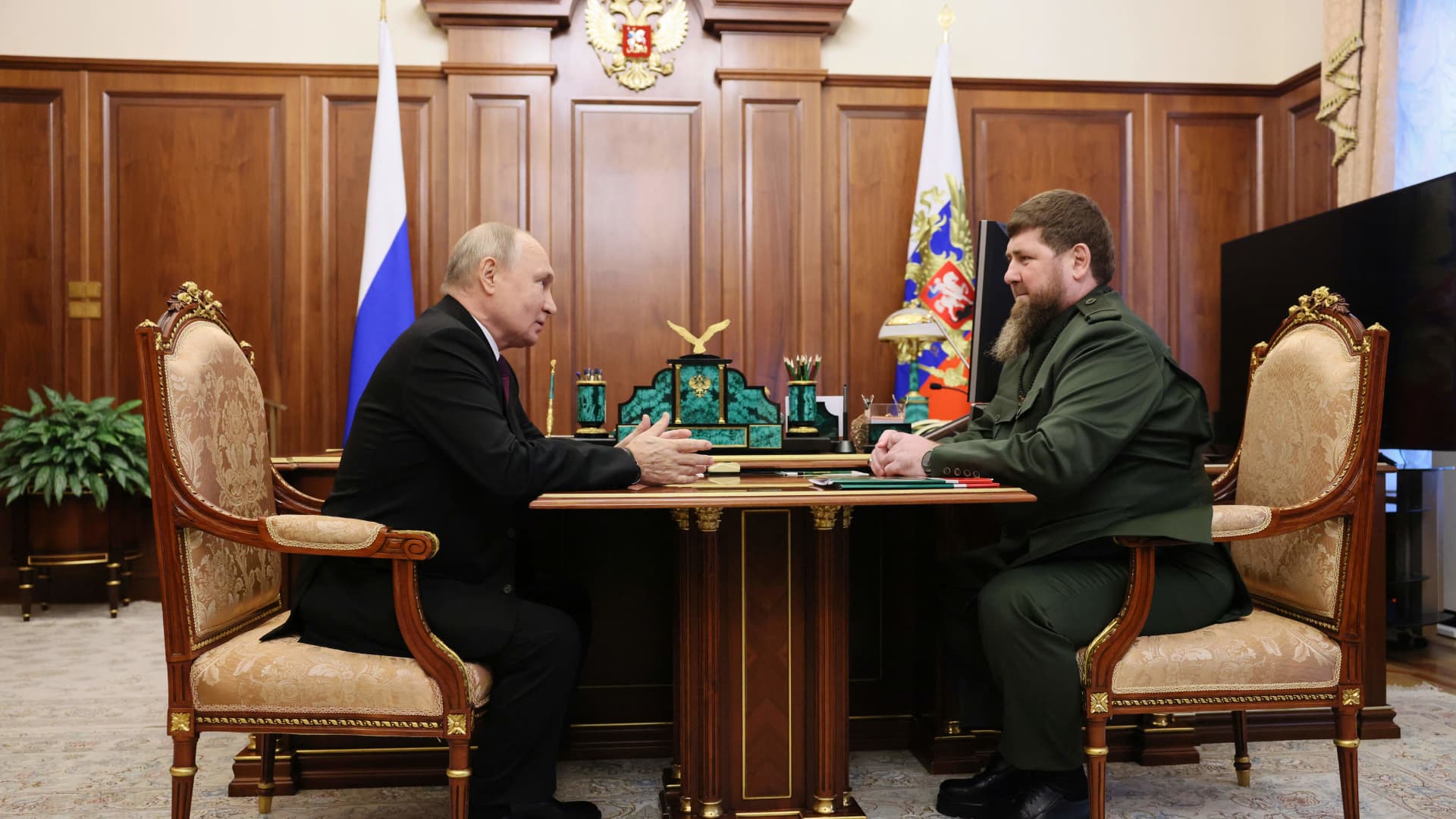 In this pool photograph distributed by Sputnik agency, Russia's President Vladimir Putin (L) attends a meeting with Chechen leader Ramzan Kadyrov (R) in Moscow on September 28, 2023.