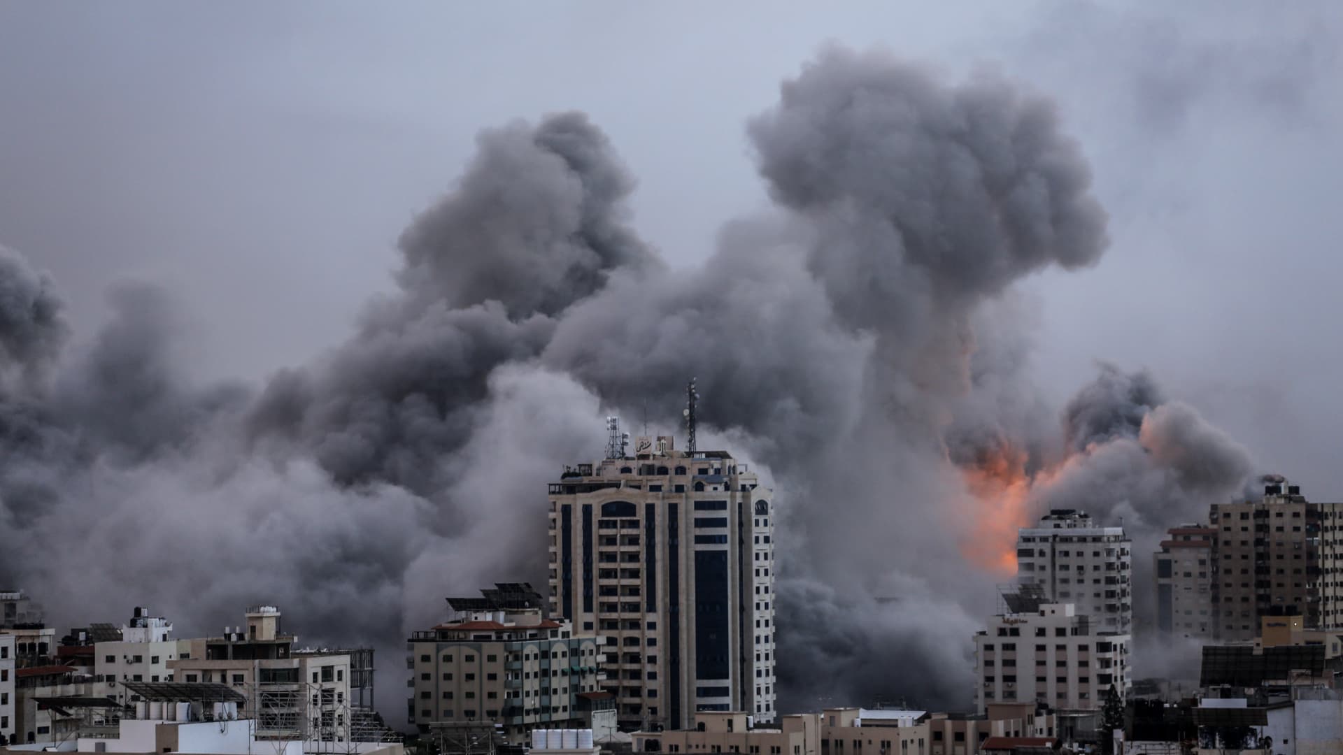 Smoke rises over a buildings in Gaza City on October 9, 2023 during an Israeli air strike.
