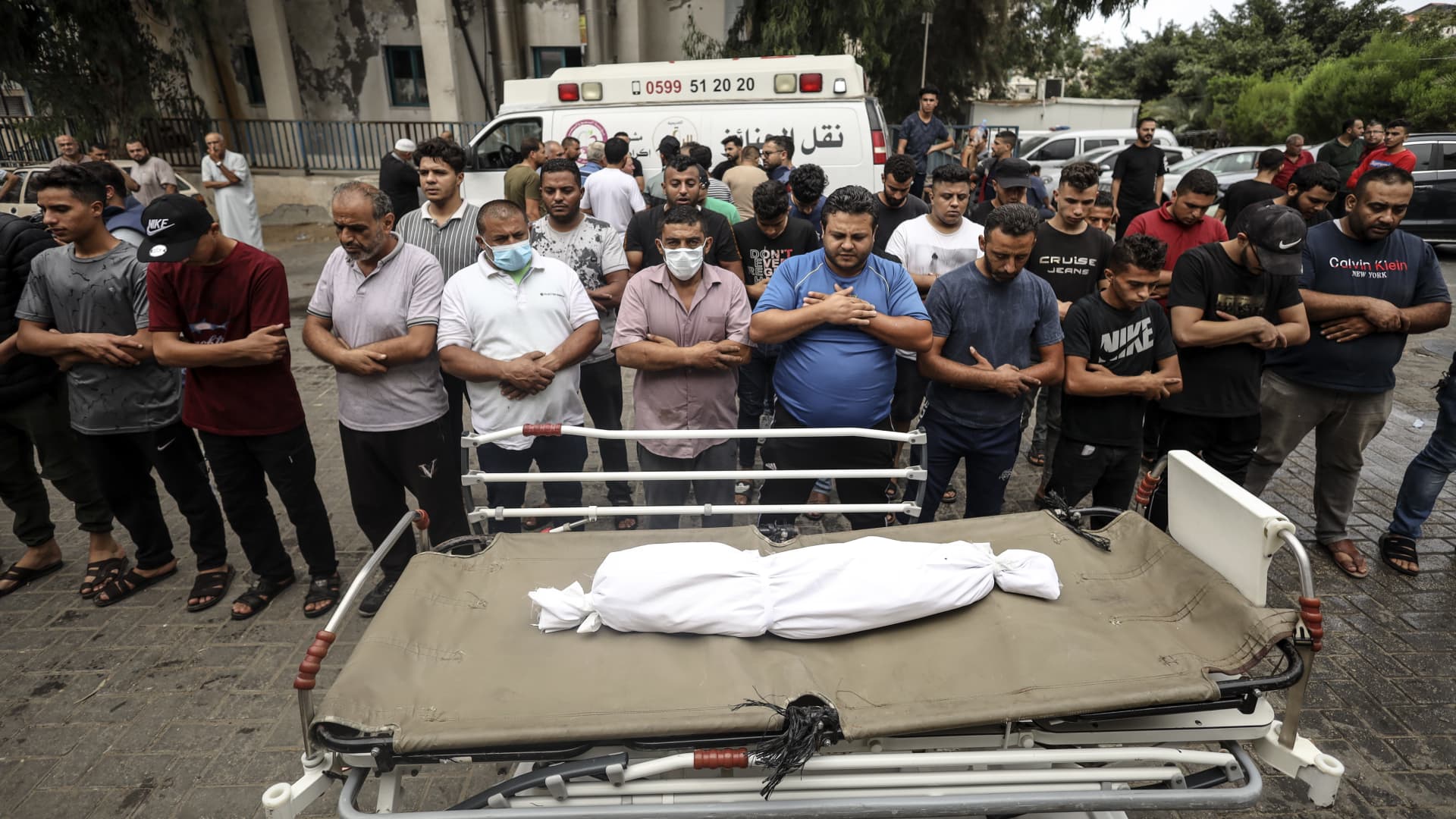 EDITORS NOTE: Graphic content: People gather at Shifa Hospital to pray over the body of a boy who was killed in Israeli strikes in Gaza City, on October 9, 2023.