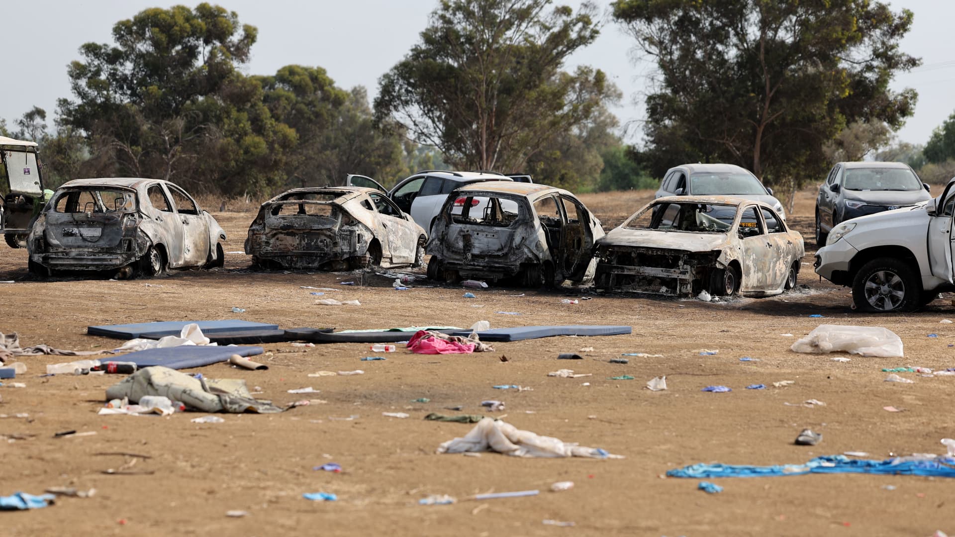 Burnt cars are left behind at the site of the weekend attack on the Supernova desert music Festival by Palestinian militants, near Kibbutz Reim in the Negev desert in southern Israel, on October 10, 2023. 