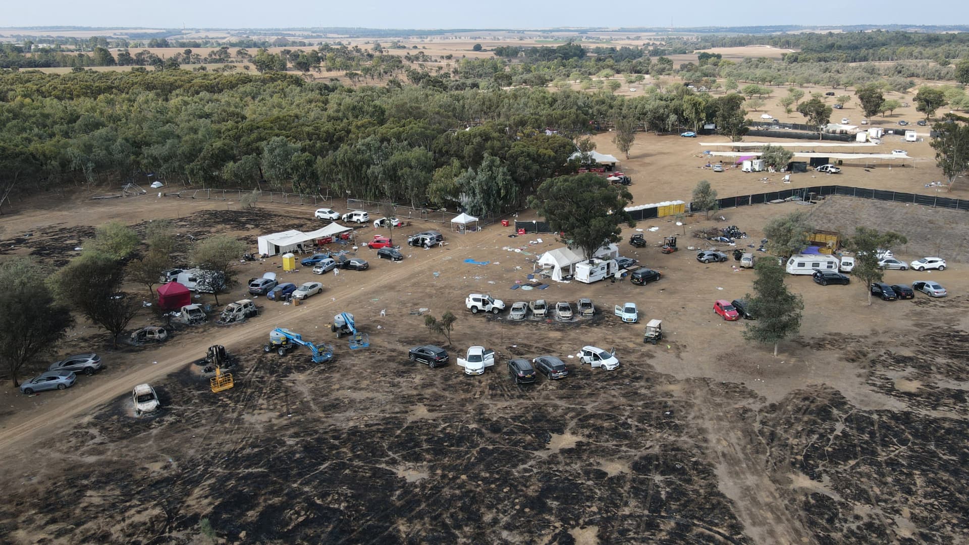 An aerial picture shows the site of the weekend attack on the Supernova desert music Festival by Palestinian militants near Kibbutz Reim in the Negev desert in southern Israel on October 10, 2023. 