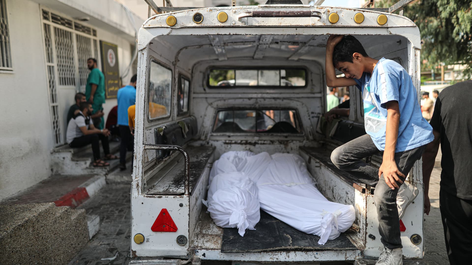 Funerals of Palestinian journalists Saeed Al-Taweel and Mohammad Sobh, who were killed in Israeli airstrikes, are placed at the back of a vehicle in Gaza Strip on October 10, 2023.