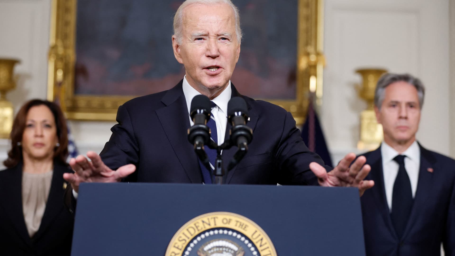 U.S. President Joe Biden, accompanied by Vice President Kamala Harris and U.S. Secretary of State Antony Blinken, makes remarks after speaking by phone with Israeli Prime Minister Benjamin Netanyahu about the situation in Israel following Hamas' deadly attacks, from the State Dining Room at the White House in Washington, October 10, 2023.