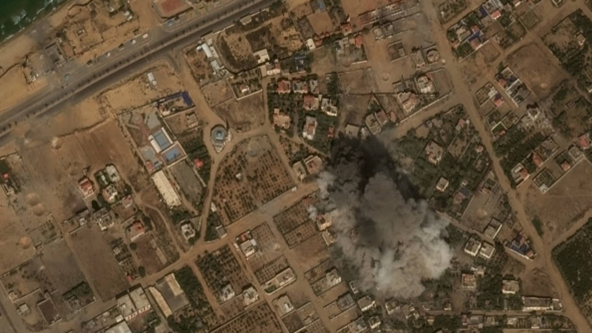 Maxar satellite imagery of a large explosion and smoke from airstrike