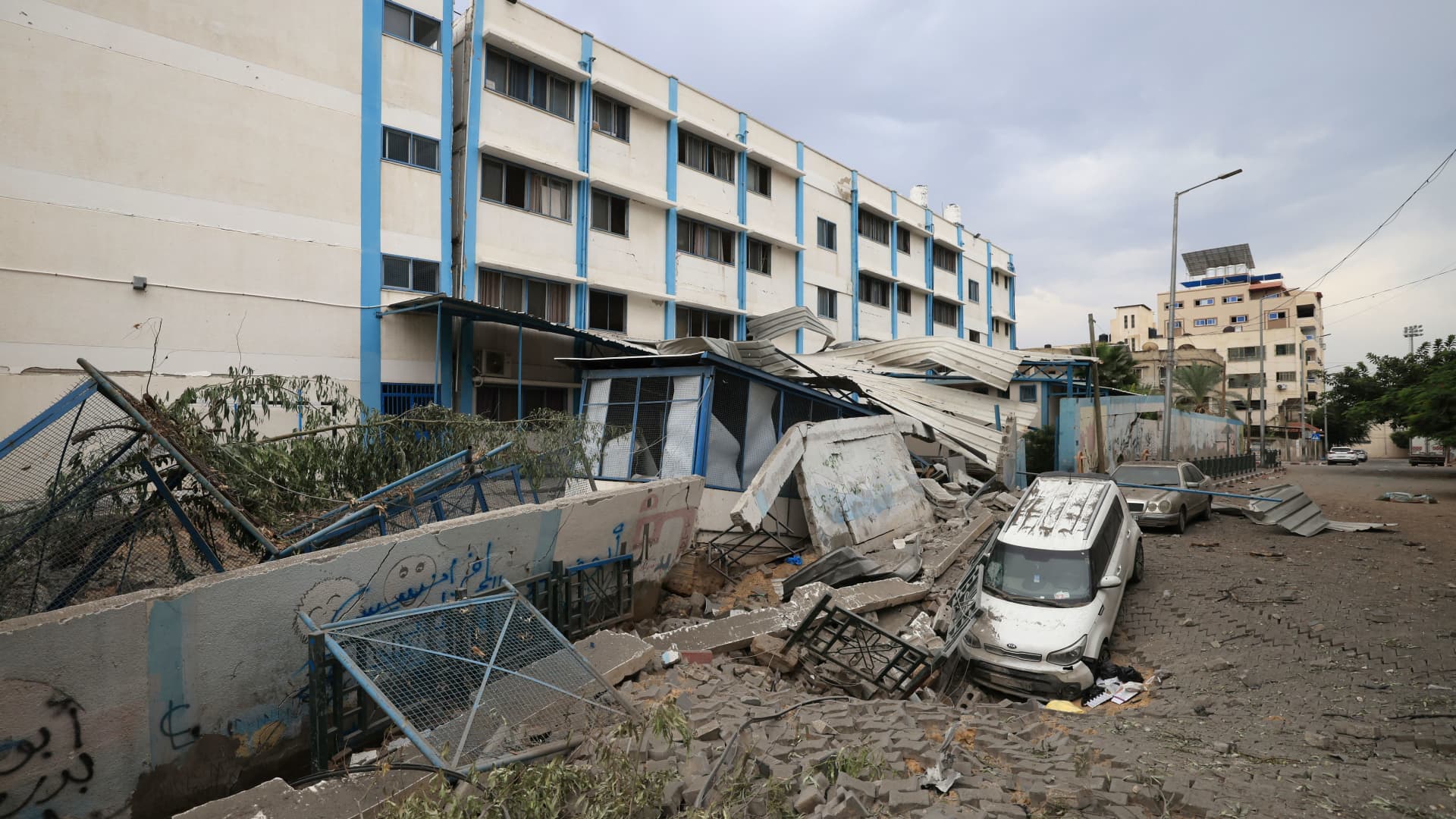 A picture taken on Oct. 9, 2023, shows the damage outside a school run by the United Nations Relief and Works Agency for Palestine refugees, following Israeli airstrikes targeting Gaza City.